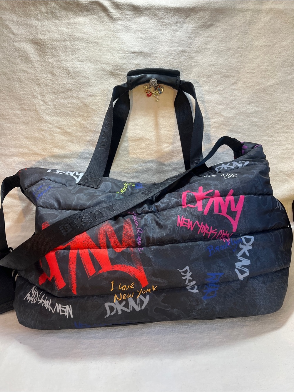 DKNY NORA Black Duffel Bag with Multicolor Graffiti Logos (P40)